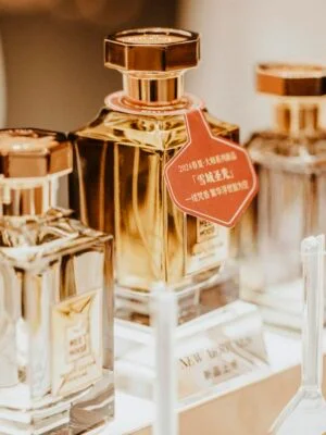 Elegant collection of perfume bottles showcasing luxury fragrances in a stylish retail display.
